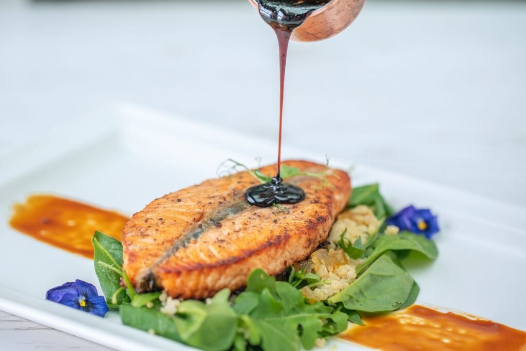 Image contains a image of cooked salmon